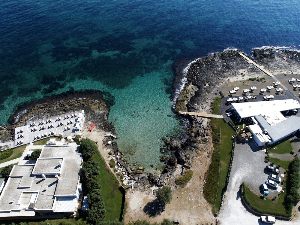 The beach club in its cove