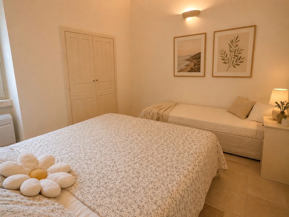 The second bedroom, with a queen and a twin