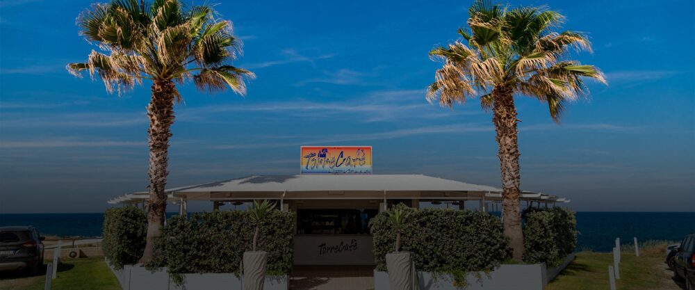 Torre Cafè beach bar beside the Torre Cintola tower at Capitolo